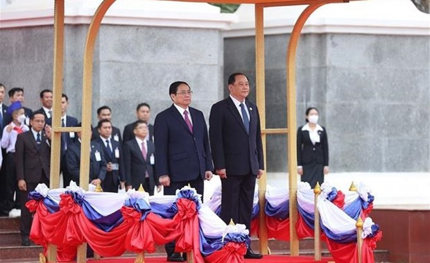 PM Sonexay Siphandone chairs official welcome ceremony for PM Pham Minh Chinh (Photo: VNA)