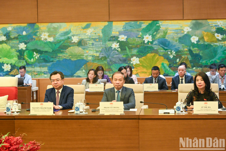 Vietnamese National Assembly delegates attend the talks.