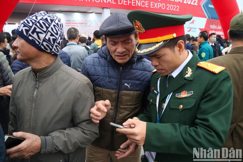 The organising board enthusiastically guides people to scan the barcode to register to attend.