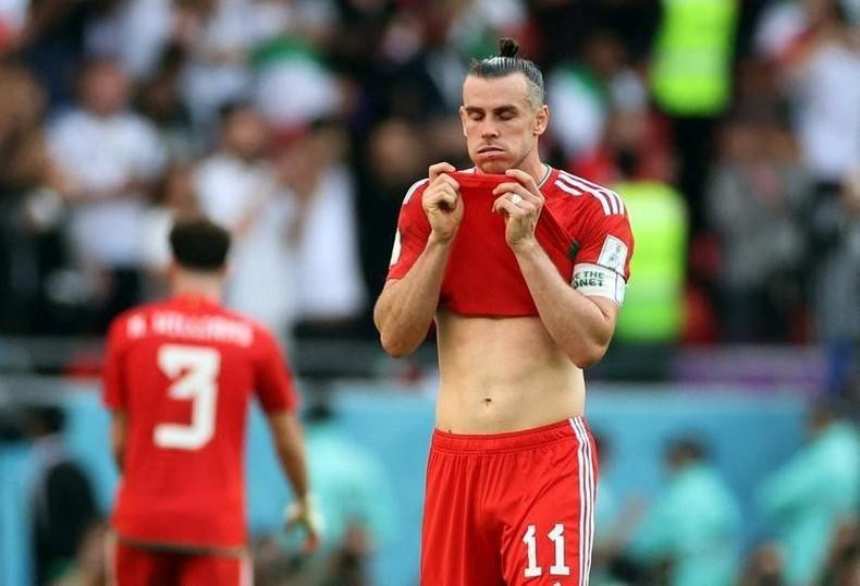 Wales' Gareth Bale looks dejected after Iran's second goal. REUTERS/Carl Recine