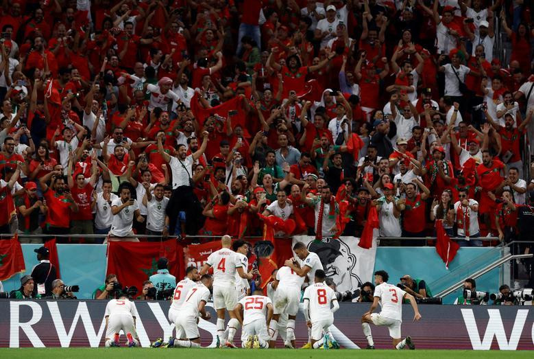 Morocco's Abdelhamid Sabiri celebrates scoring their first goal against Belgium with teammates. REUTERS/Amanda Perobelli
