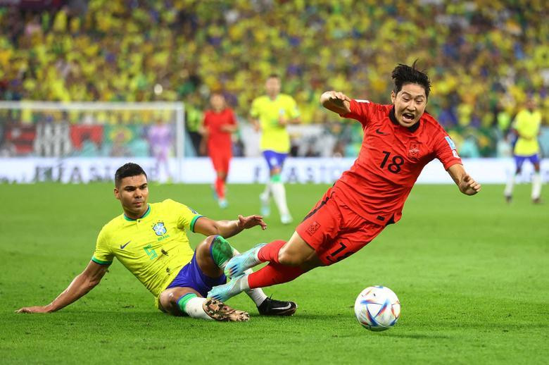 Brazil's Casemiro in action with South Korea's Lee Kang-in. REUTERS/Carl Recine
