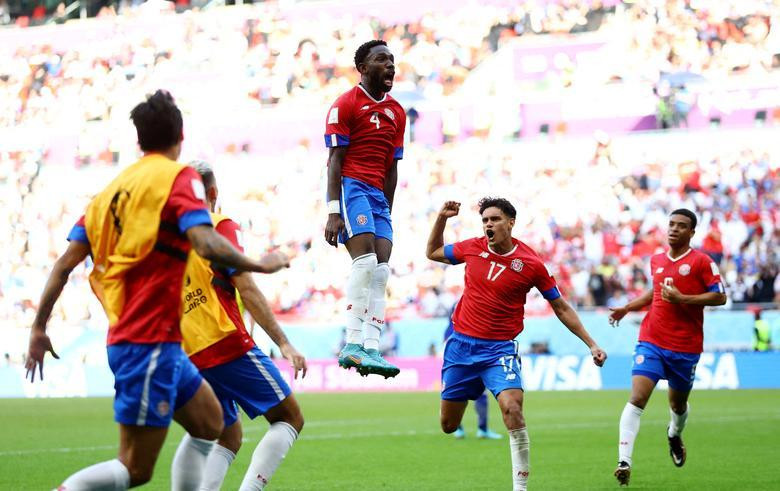 Costa Rica's Keysher Fuller celebrates scoring their first goal against Japan with Yeltsin Tejeda and teammates. REUTERS/Hannah Mckay