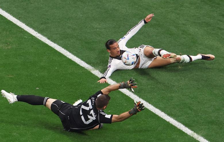 Germany's Leroy Sane in action with Spain's Unai Simon. REUTERS/Molly Darlington