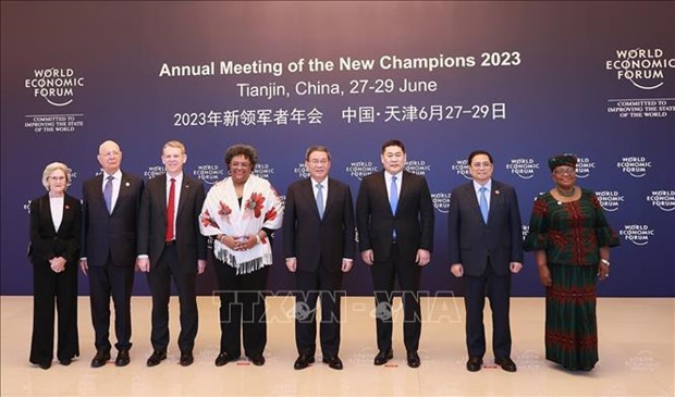 Prime Minister Pham Minh Chinh (second from right) and heads of delegations attending the WEF Annual Meeting in a group photo. (Photo: VNA) Prime Minister Pham Minh Chinh (second from right) and heads of delegations attending the WEF Annual Meeting in a group photo. (Photo: VNA)