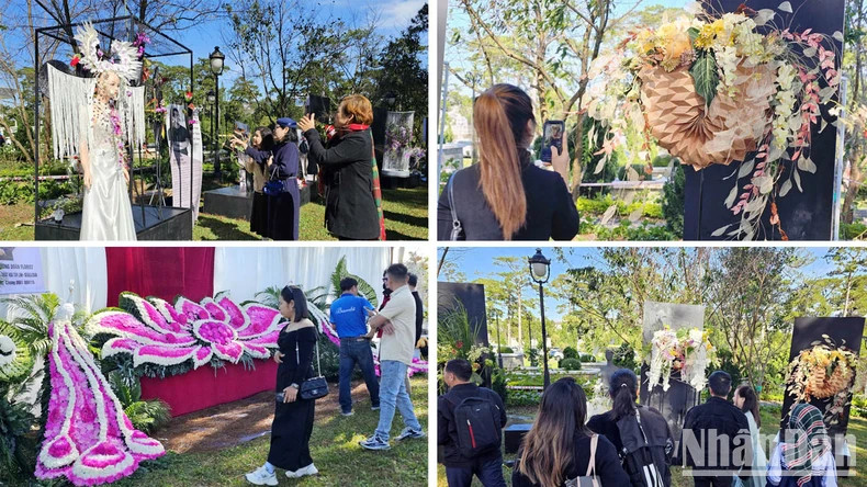 Fresh flower art works at the exhibition space attract viewers. Fresh flower art works at the exhibition space attract viewers.