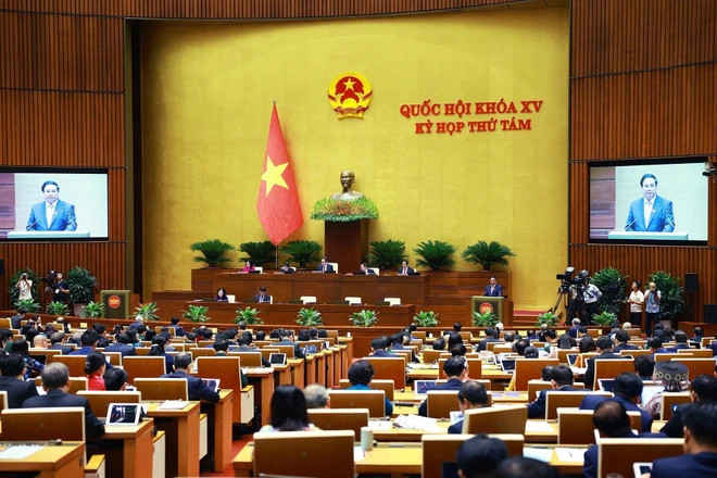 Prime Minister Pham Minh Chinh delivers a report at the ongoing 8th session of the 15th National Assembly in Hanoi on October 21. (Photo: VNA) Prime Minister Pham Minh Chinh delivers a report at the ongoing 8th session of the 15th National Assembly in Hanoi on October 21. (Photo: VNA)