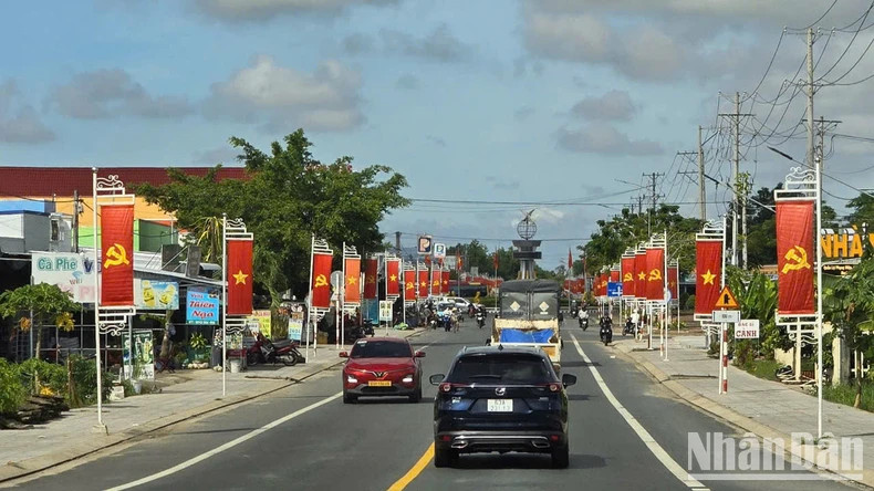 Beautiful flag line on Quang Lo-Phung Hiep Road through Phuoc Long District, Bac Lieu Province. Beautiful flag line on Quang Lo-Phung Hiep Road through Phuoc Long District, Bac Lieu Province.