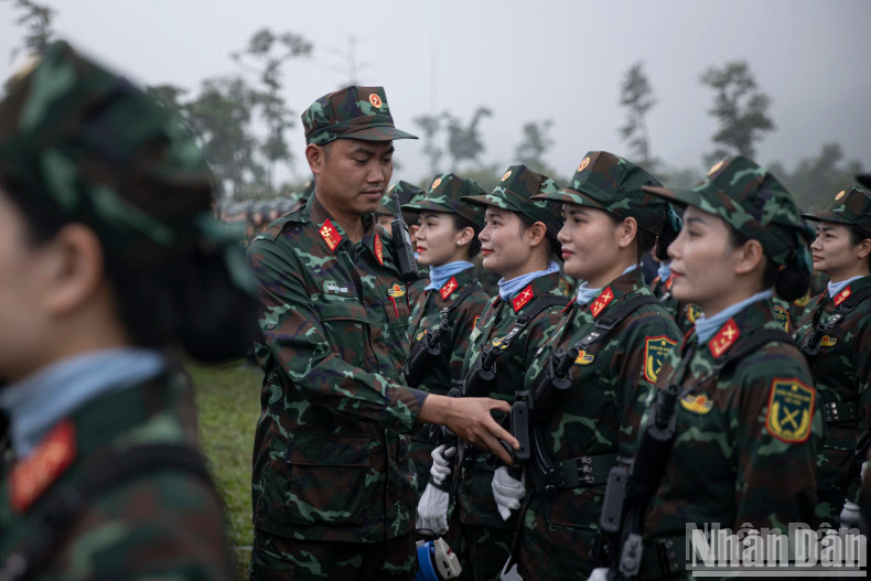 The Vietnamese female peacekeeping forces prepare to participate in the rehearsal.