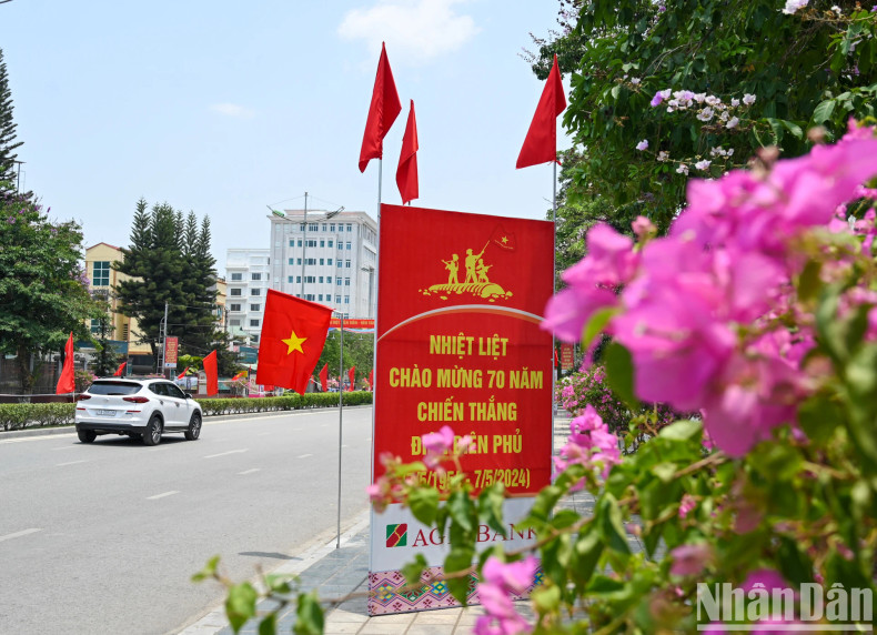 Flowers, national flags, and slogans are seen everywhere in Dien Bien Phu City.