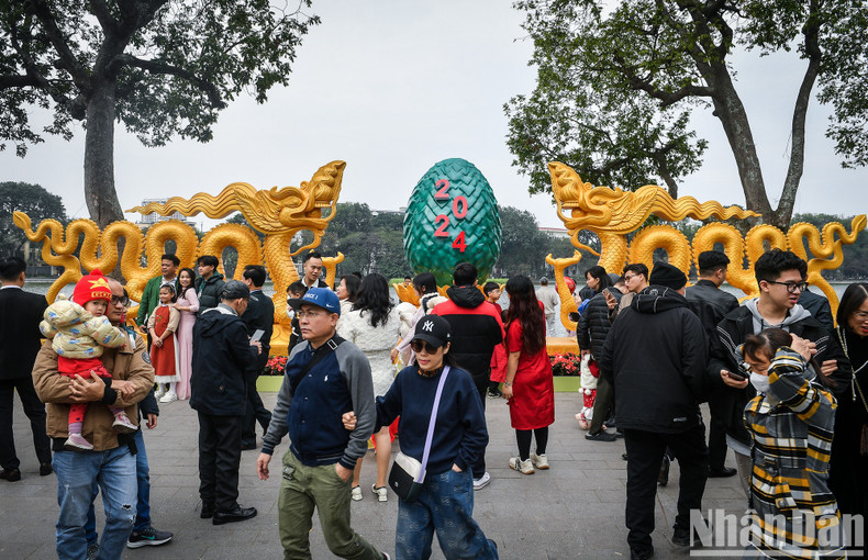 Hoan Kiem (Sword) Lake in downtown Hanoi is a favourite check-in place of visitors and local people on the first day of Lunar New Year.