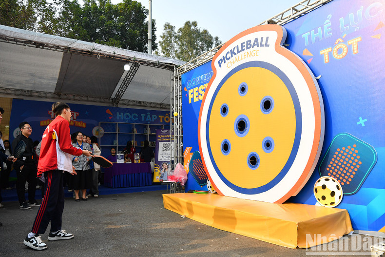A student takes part in a pickle ball challenge at the event. A student takes part in a pickle ball challenge at the event.
