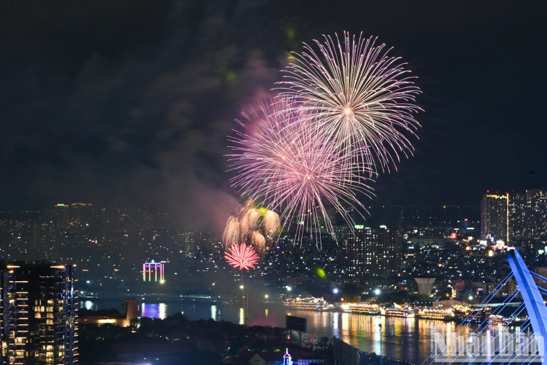 Dazzling fireworks lit up the sky over the Saigon River