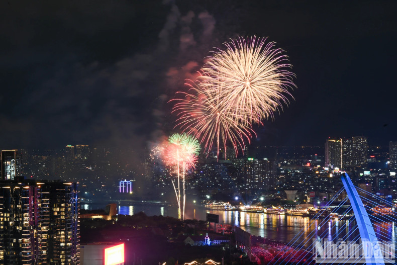 Colourful fireworks illuminated the sky above the Saigon River