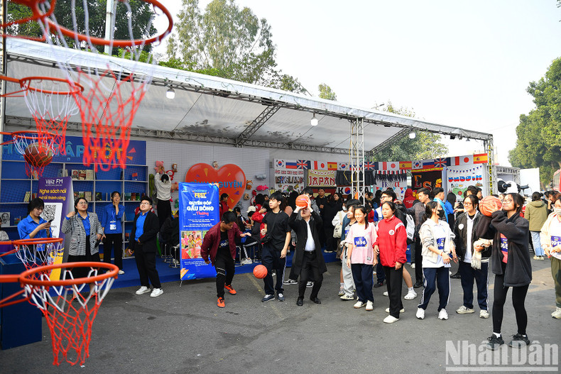 Youngsters join a basketball game at the festival. Youngsters join a basketball game at the festival.