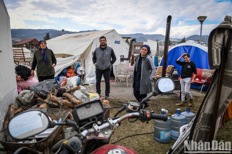 All the remaining precious possessions of this small family were gathered in the open ground behind their tent. All the remaining precious possessions of this small family were gathered in the open ground behind their tent.
