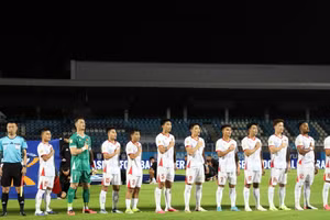 Viet Nam's players salute the national flag and sing the national anthem before their Group A match against Timor-Leste at the 2026 ASEAN Cup. (Photo: VNA)