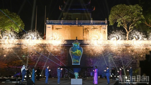 Guests take part in the opening ceremony, which features a blend of traditional craftsmanship and modern technology. 
