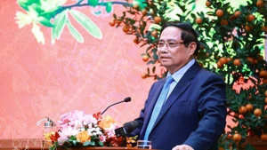 Prime Minister Pham Minh Chinh addresses the reception for outstanding intellectuals, artists, journalists, athletes, coaches and representatives of cultural and tourism enterprises on February 23. (Photo: VNA)