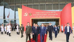Politburo member and Permanent member of the Party Central Committee’s Secretariat Tran Cam Tu (front, centre) and other officials examine organisational arrangements for 14th National Party Congress on January 14. (Photo: VNA)