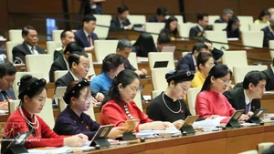 Female deputies of the National Assembly attend the opening session of the ninth sitting of the 15th National Assembly on May 5, 2025. (Photo: VNA)