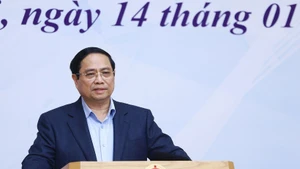 Prime Minister Pham Minh Chinh speaks at the conference on January 14 to review the National Steering Committee for International Integration’s performance in 2025 and outline key tasks for this year. (Photo: VNA)