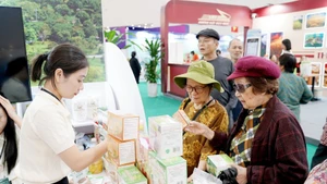 Agricultural cooperatives introduce their products at a trade fair. Photo: NAM NGUYEN