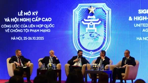 Delegates attend the discussion session.