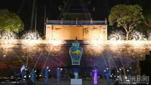 Guests take part in the opening ceremony, which features a blend of traditional craftsmanship and modern technology. 