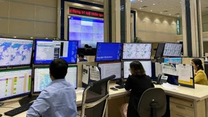 Forecasters analyse data on the SmartMet system to issue forecasts and early disaster warnings at the National Centre for Hydro-Meteorological Forecasting. (Photo: HOAI LINH)