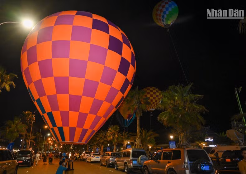 Colourful hot air balloon performance in the night sky in Phan Thiet city.
