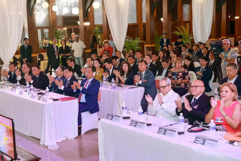 Delegates attend the forum. (Photo: DOAN TAN)