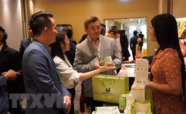 At the Vietnamese trade-investment promotion event in Australia on September 11 (Photo: VNA)