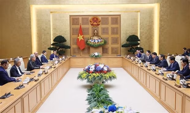 At the meeting between Prime Minister Pham Minh Chinh and President and CEO of Nvidia. (Photo: VNA)