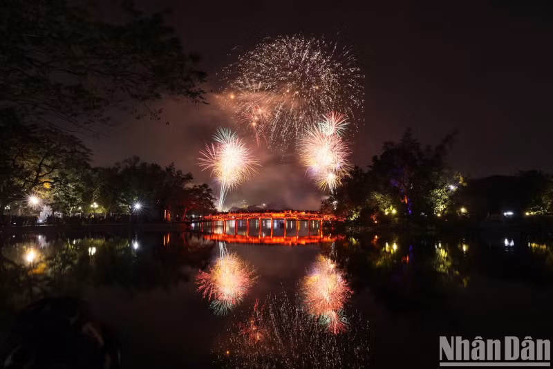 Fireworks illuminate the sky above The Huc Bridge.