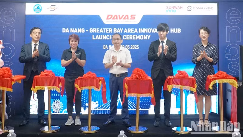 Delegates cut the ribbon to launch the innovation hub.