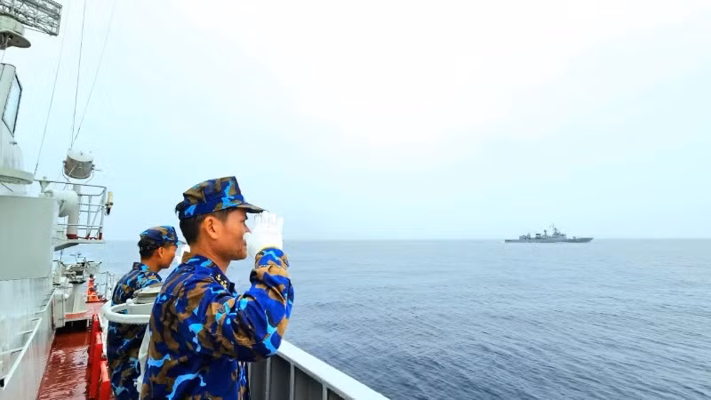 The joint naval task force commanders perform the Hello ASEAN greeting procedure at sea.