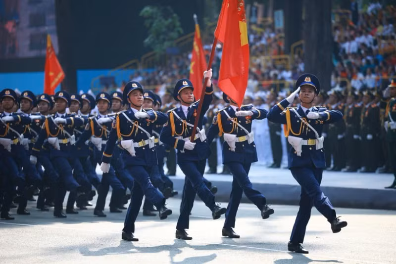 Coast guard officers march past the grandstand at the parade in HCM City on April 30. (Photo: VNA)