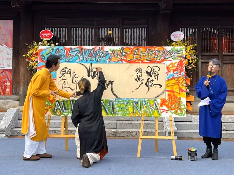 Graffiti artists and calligraphers perform a piece together at the opening ceremony. 