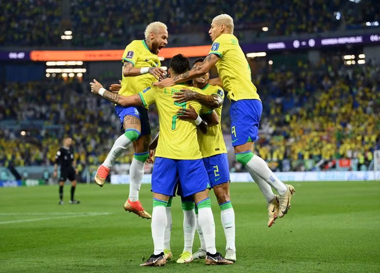 Brazil's Vinicius Junior celebrates scoring their first goal with teammates. REUTERS/Annegret Hilse