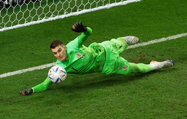 Croatia's Dominik Livakovic saves a penalty from Japan's Kaoru Mitoma during the shootout. REUTERS/Lee Smith