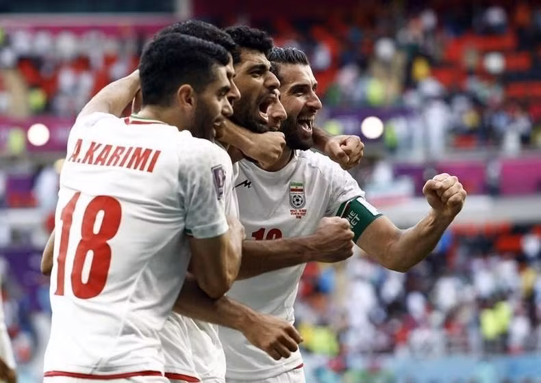 Iran's Karim Ansarifard and teammates celebrate after the match. REUTERS/Amanda Perobelli