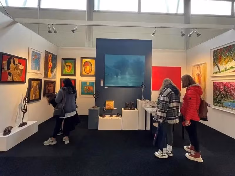 Visitors look at artworks by 13 Vietnamese painters at the Affordable Art Fair in London.(Photo: VNA)