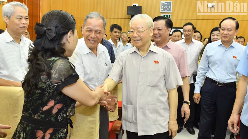 Party General Secretary Nguyen Phu Trong with delegates and voters in Hanoi.