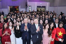General Secretary of the Communist Party of Viet Nam (CPV) Central Committee To Lam, Aalto University President Ilkka Niemela, and Vietnamese students studying in Helsinki (Photo: VNA)