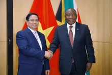 Vietnamese Prime Minister Pham Minh Chinh (L) and South African President Cyril Ramaphosa at their meeting on November 21. (Photo: VGP)