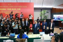 PM Pham Minh Chinh visits the press centre serving the 14th National Party Congress (Photo: VNA)