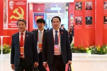 Delegates arrive for the opening session of the 14th National Congress of the Communist Party of Viet Nam. (Photo: TRAN HAI)