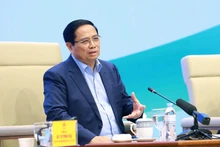 Prime Minister Pham Minh Chinh speaks at the dialogue with farmers on December 10. (Photo: VNA)
