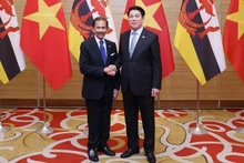 President Luong Cuong and Sultan of Brunei Haji Hassanal Bolkiah at the state banquet held in honour of the Sultan in Ha Noi on December 1. (Photo: VNA)